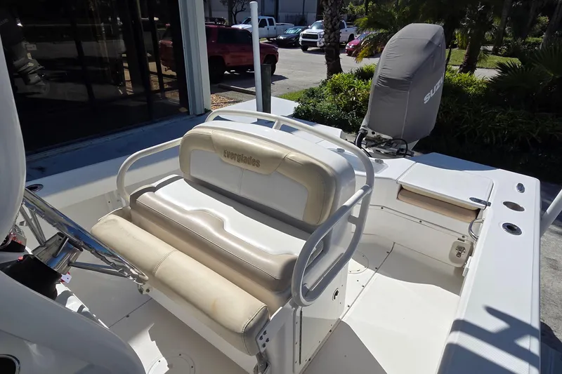 Slide: The Image of 2005 Everglades 223 Center Console boat interior with seating and covered engine. - 7