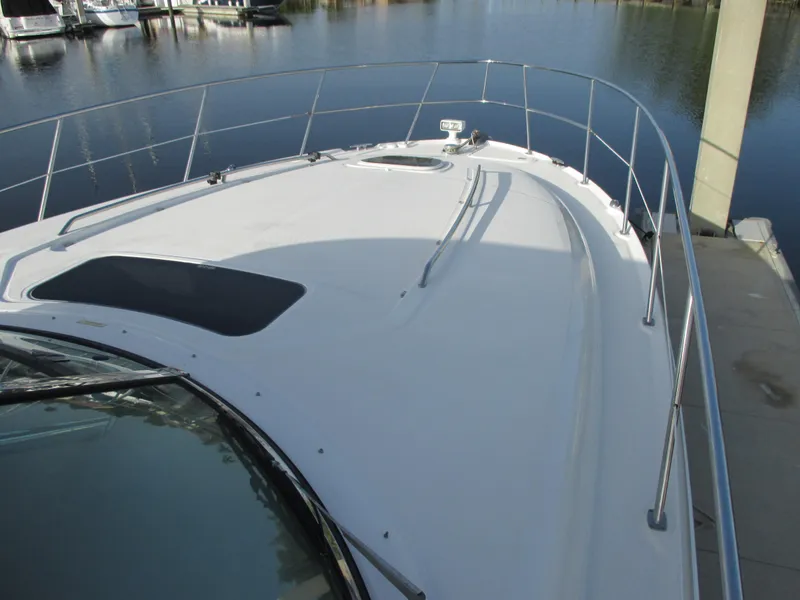 Slide: The Image of 2005 Sea Ray 390 Sundancer docked on calm water. - 10