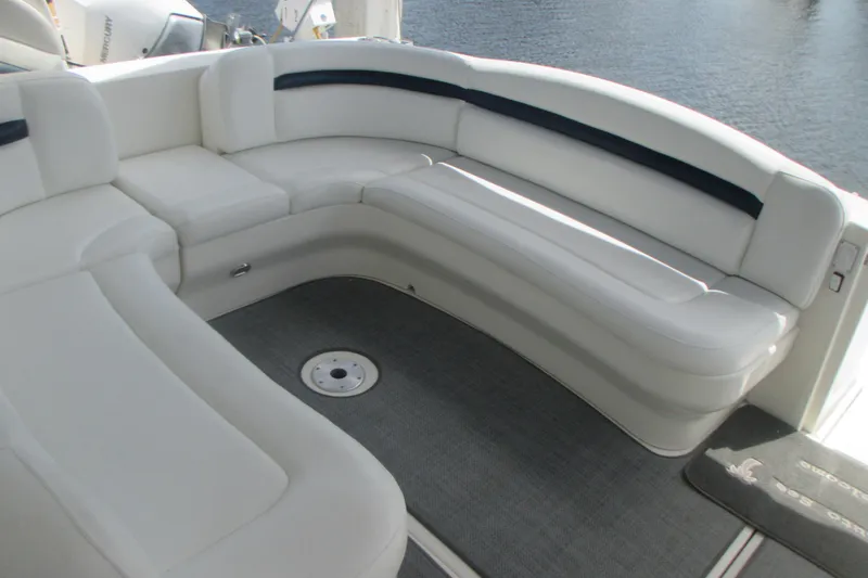 Slide: The Image of Luxurious seating area on a 2005 Sea Ray 390 Sundancer yacht, overlooking water. - 13