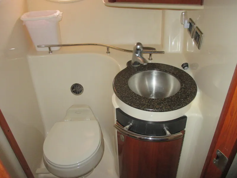 Slide: The Image of 2005 Sea Ray 390 Sundancer bathroom with sink and toilet. - 34