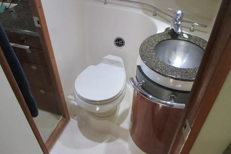 Slide: The Image of Bathroom interior of 2005 Sea Ray 390 Sundancer yacht with toilet and sink. - 35