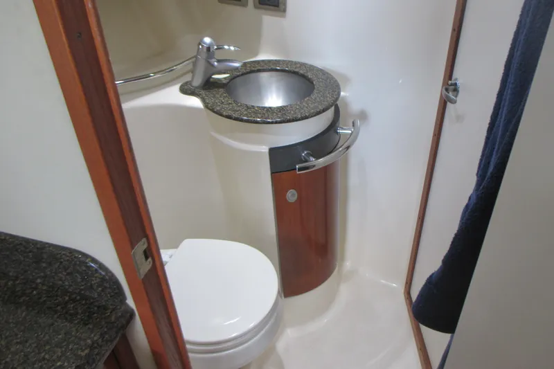 Slide: The Image of Compact bathroom in 2005 Sea Ray 390 Sundancer yacht with sink and toilet. - 36