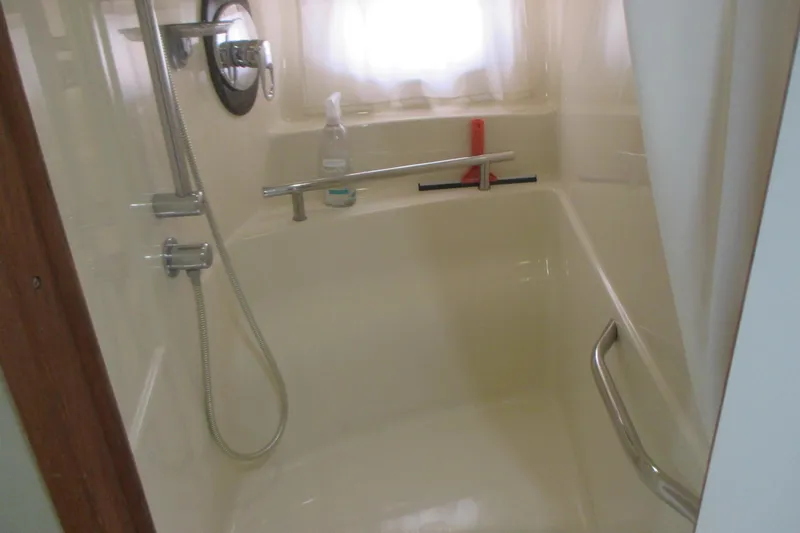 Slide: The Image of Bathroom shower area in a 2005 Sea Ray 390 Sundancer yacht. - 39