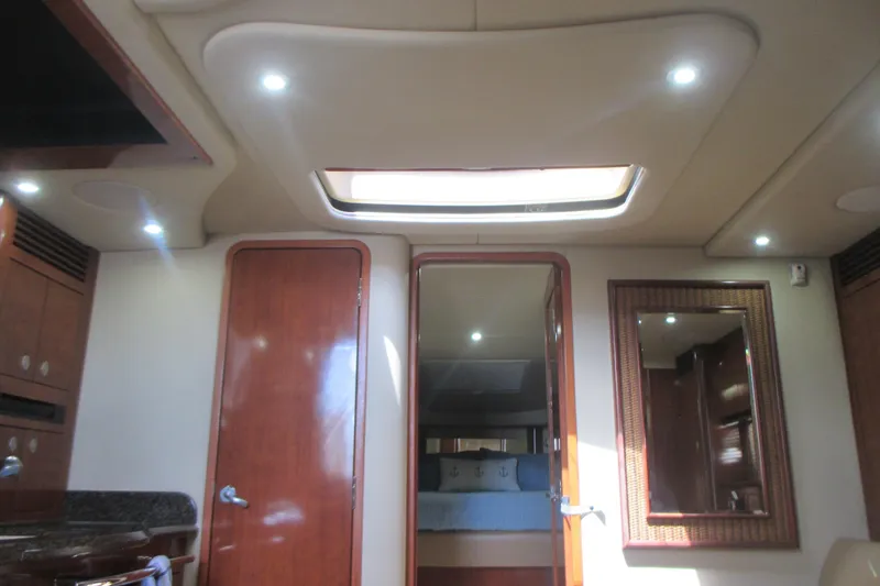 Slide: The Image of Interior of 2005 Sea Ray 390 Sundancer yacht with wood finishes and skylight. - 43