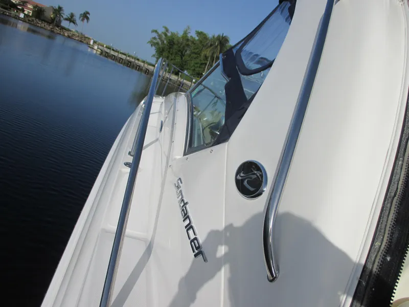 Slide: The Image of 2005 Sea Ray 390 Sundancer by the water, side view. - 8