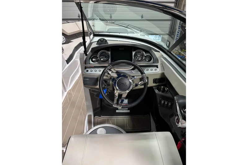 Slide: The Image of 2023 Monterey 278SS Super Sport boat cockpit with modern steering and dashboard controls. - 4