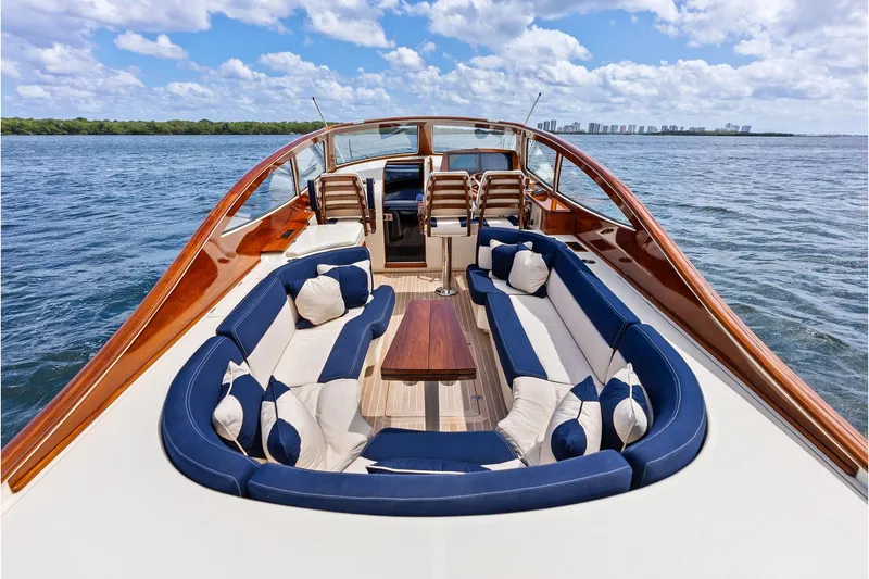 Slide: The Image of Luxurious 2008 Hinckley Talaria 38R yacht with elegant seating and scenic ocean view. - 10
