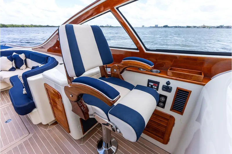 Slide: The Image of Luxury interior of 2008 Hinckley Talaria 38R yacht with elegant seating and wood accents. - 16