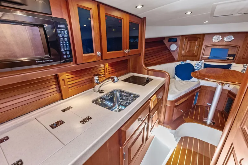 Slide: The Image of Luxurious 2008 Hinckley Talaria 38R yacht interior with kitchenette and seating area. - 18
