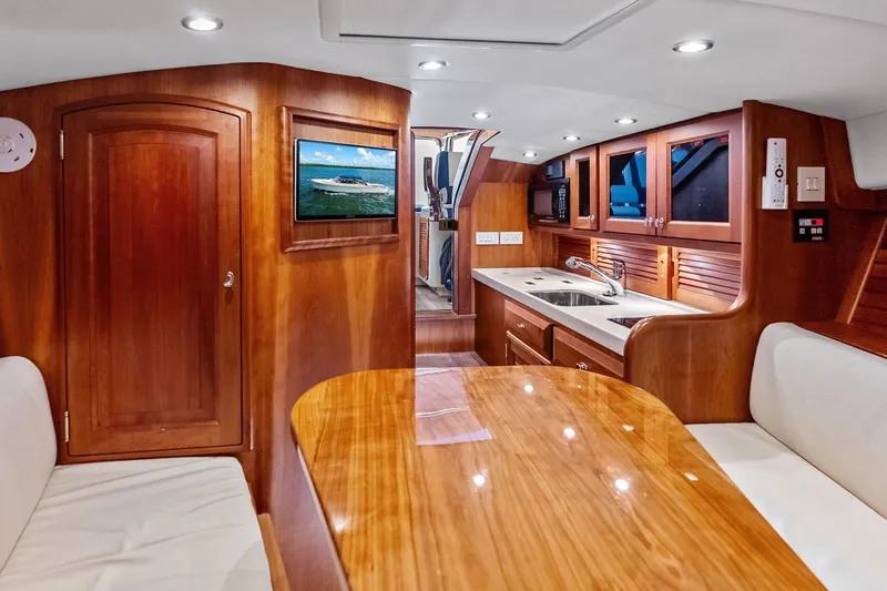 Slide: The Image of Luxurious 2008 Hinckley Talaria 38R yacht interior with elegant wood finishes and modern amenities. - 21