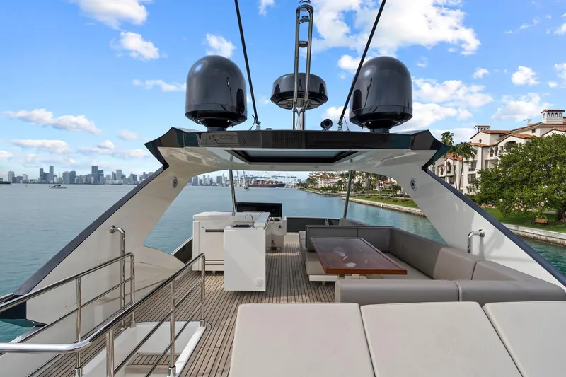 Slide: The Image of Flybridge of 2022 Astondoa 66 yacht with sink and seating area, overlooking marina. - 13
