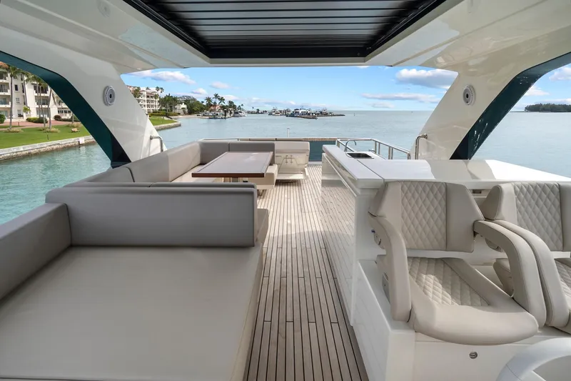 Slide: The Image of 2022 Astondoa 66 Flybridge yacht with spacious deck and city skyline view. - 15