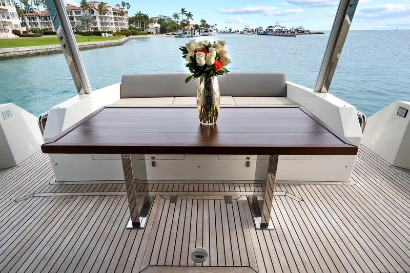 Slide: The Image of Astondoa 66 Flybridge 2022 yacht cruising near luxury waterfront residences. - 18