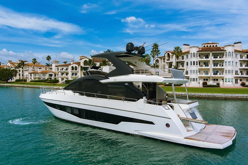 Slide: The Image of Luxurious bedroom interior of 2022 Astondoa 66 Flybridge yacht with scenic ocean view. - 2