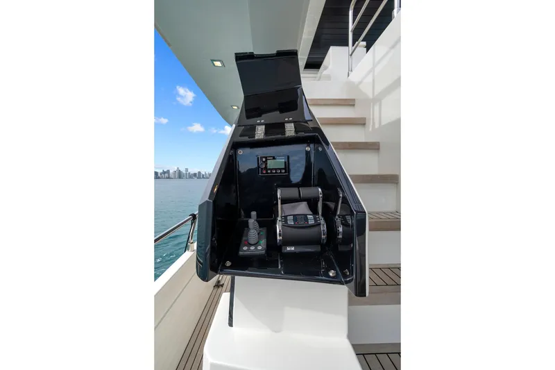 Slide: The Image of Luxurious 2022 Astondoa 66 Flybridge yacht deck with elegant table and floral centerpiece. - 20