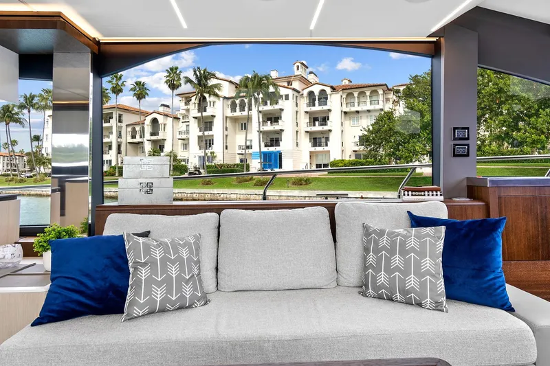 Slide: The Image of Elegant interior of 2022 Astondoa 66 Flybridge yacht with floral centerpiece and scenic view. - 23