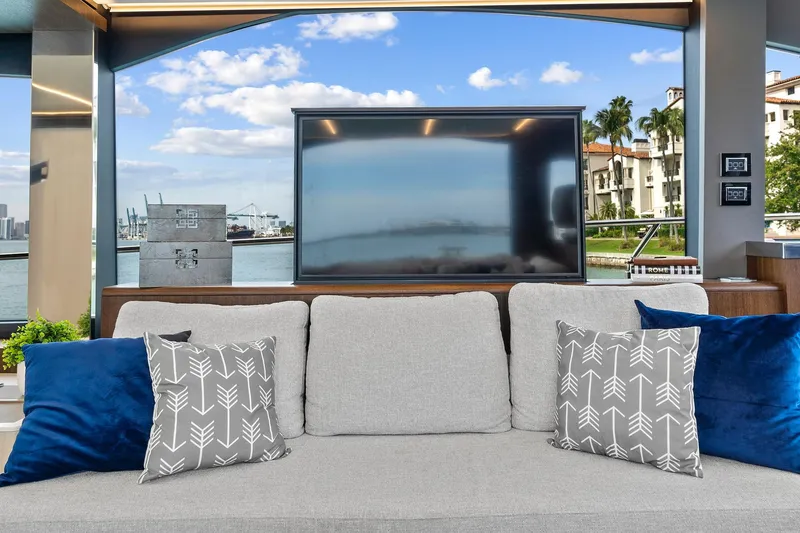 Slide: The Image of Luxurious interior of 2022 Astondoa 66 Flybridge yacht with scenic waterfront view. - 25
