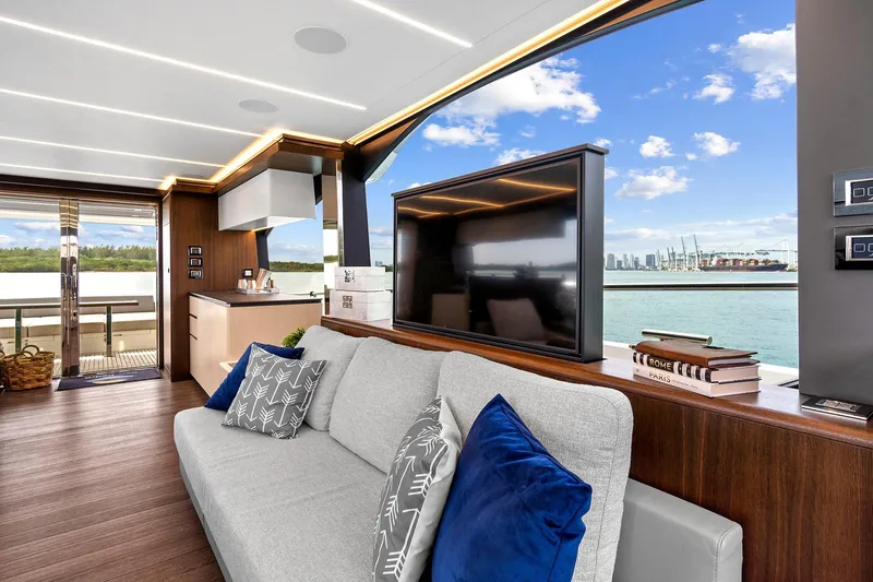 Slide: The Image of Luxurious Astondoa 66 Flybridge 2022 yacht interior with plush seating and scenic water view. - 26