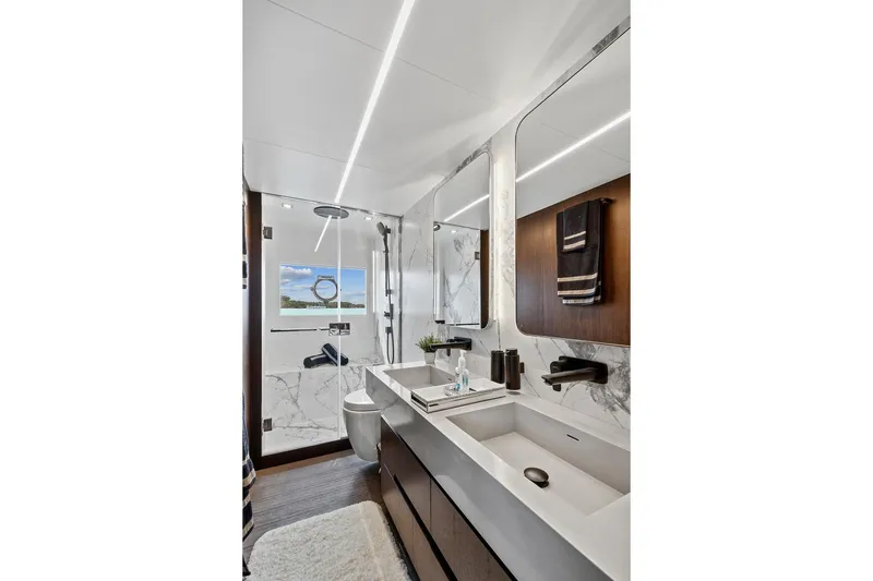 Slide: The Image of Luxurious bathroom in 2022 Astondoa 66 Flybridge yacht with modern fixtures and marble accents. - 43