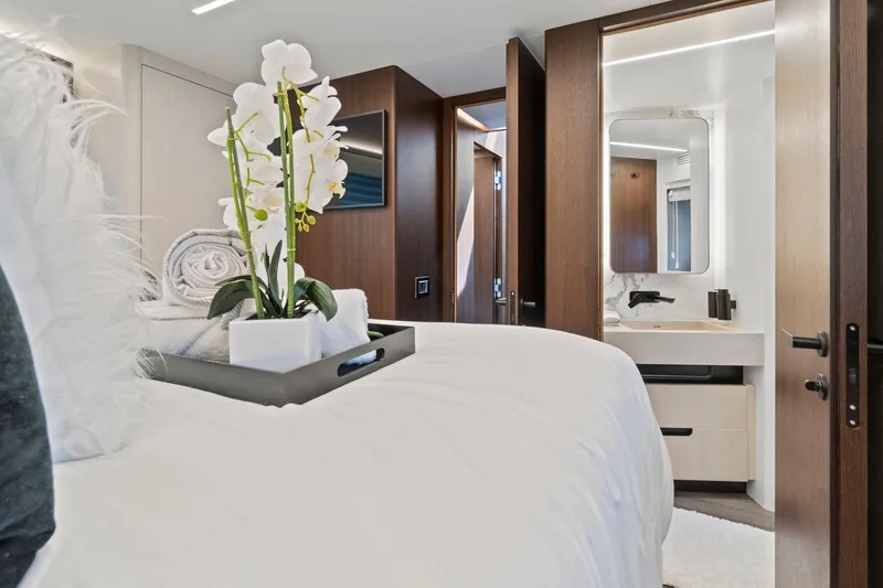 Slide: The Image of Luxurious interior of 2022 Astondoa 66 Flybridge yacht with elegant bedroom and ensuite bathroom. - 49