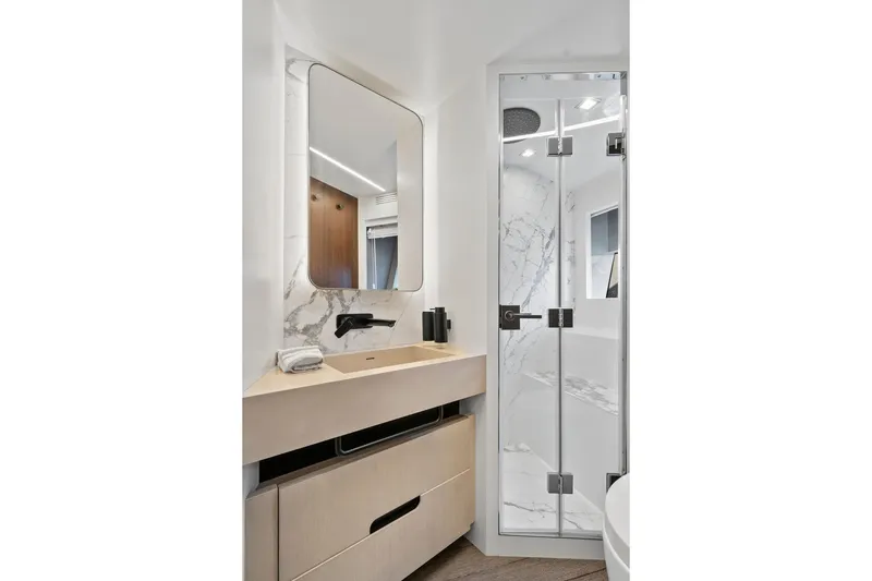 Slide: The Image of Luxurious bathroom in 2022 Astondoa 66 Flybridge yacht with modern fixtures and marble accents. - 50