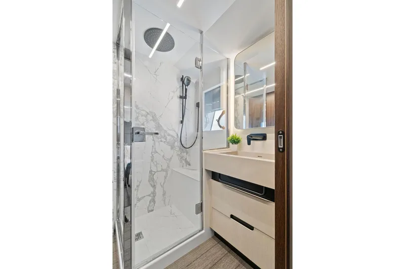 Slide: The Image of Luxurious bathroom in 2022 Astondoa 66 Flybridge yacht with modern shower and vanity. - 52