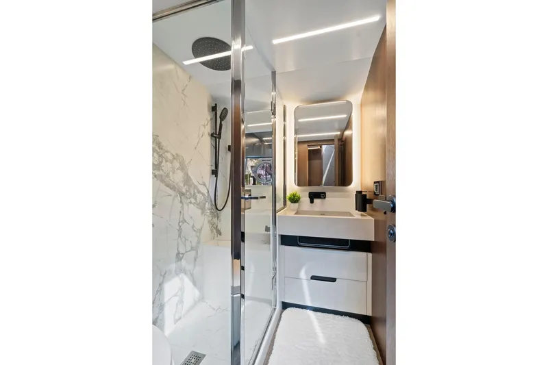 Slide: The Image of Luxurious bathroom in 2022 Astondoa 66 Flybridge yacht with modern fixtures and marble accents. - 53