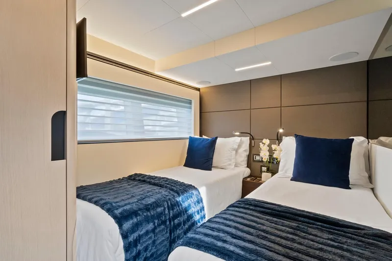 Slide: The Image of Luxurious twin bedroom in 2022 Astondoa 66 Flybridge yacht with modern decor. - 54