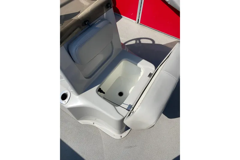 Slide: The Image of Open storage compartment on 2016 Silver Wave 230 Island CC boat. - 3