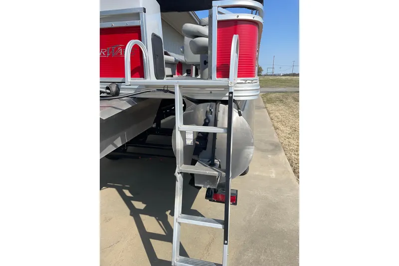 Slide: The Image of Silver Wave 230 Island CC 2016 boat with ladder and red accents. - 5