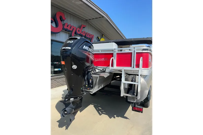 Slide: The Image of 2016 Silver Wave 230 Island CC boat with Mercury outboard motor, parked outside Sundown store. - 6