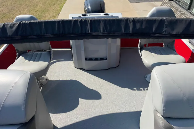 Slide: The Image of 2016 Silver Wave 230 Island CC boat interior with gray seating and console. - 7