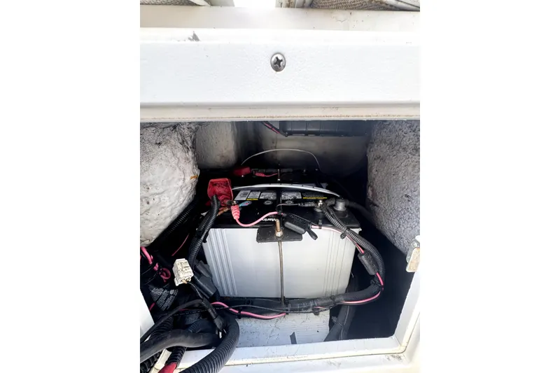 Slide: The Image of Battery compartment of a 2007 ProKat 2560 DC boat with wiring connections. - 11