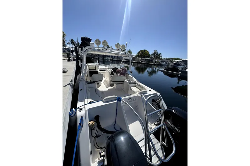 Slide: The Image of 2007 ProKat 2560 DC boat docked, featuring dual engines and spacious seating. - 4