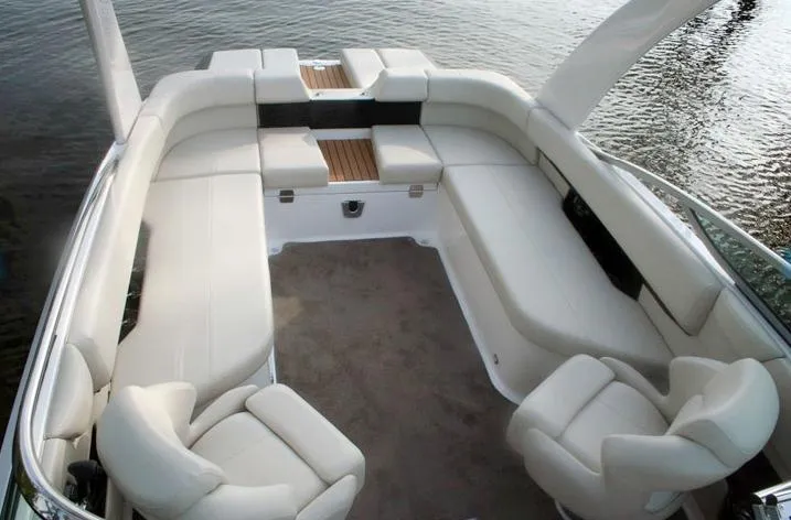 Slide: The Image of Manufacturer Provided Image: 2012 Regal 2500 Bowrider boat interior with spacious seating and water view. - 17