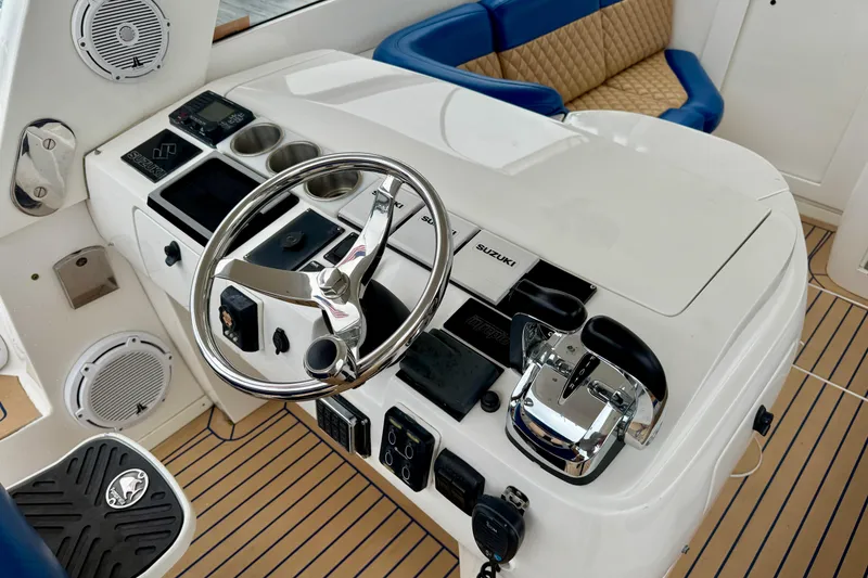 Slide: The Image of Helm of 2012 Intrepid 390 Sport Yacht with steering wheel and controls. - 10