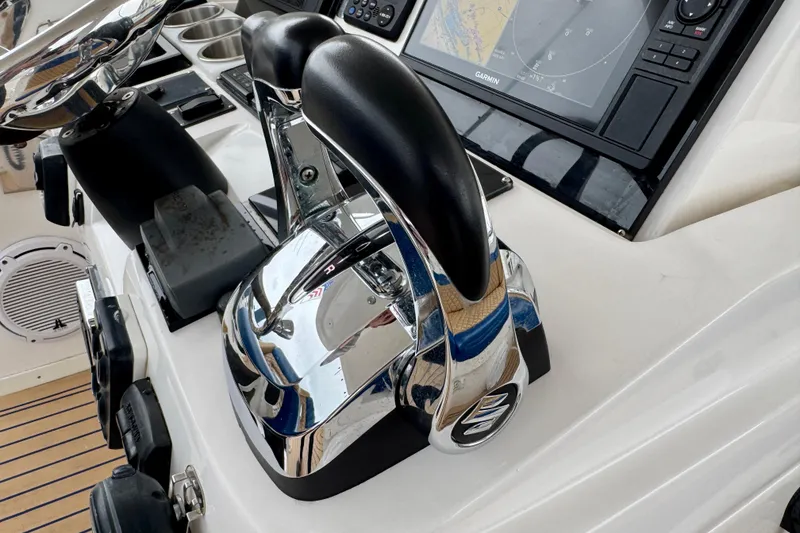 Slide: The Image of Control panel of a 2012 Intrepid 390 Sport Yacht with navigation equipment. - 12