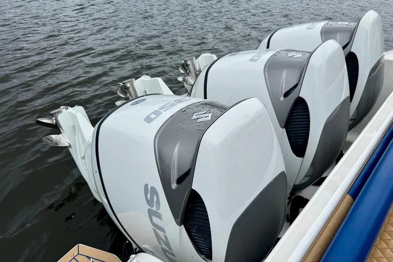 Slide: The Image of Triple Suzuki outboard engines on a 2012 Intrepid 390 Sport Yacht. - 15
