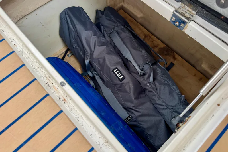 Slide: The Image of Storage compartment on a 2012 Intrepid 390 Sport Yacht with YETI bags inside. - 21