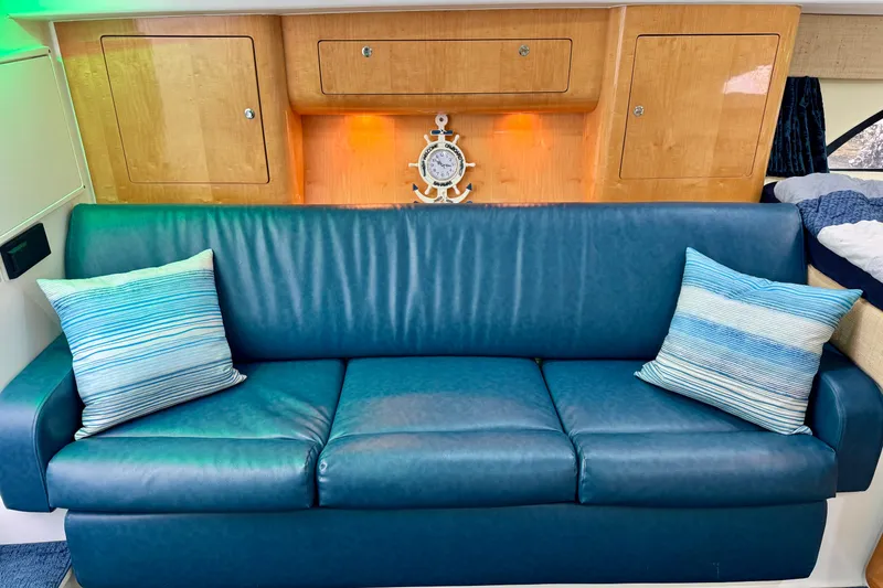 Slide: The Image of Luxurious blue leather sofa in 2012 Intrepid 390 Sport Yacht interior. - 26