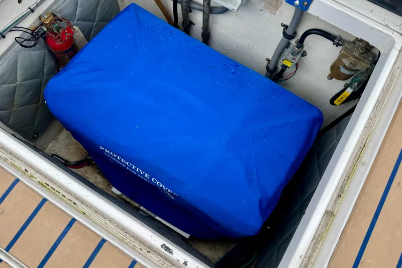 Slide: The Image of Engine compartment of 2012 Intrepid 390 Sport Yacht with blue protective cover. - 29