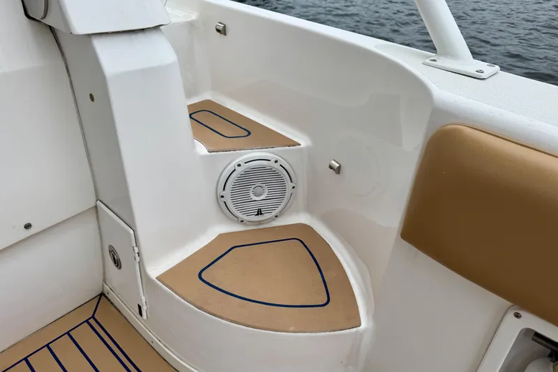Slide: The Image of Interior of 2012 Intrepid 390 Sport Yacht with speaker and cushioned seating. - 39