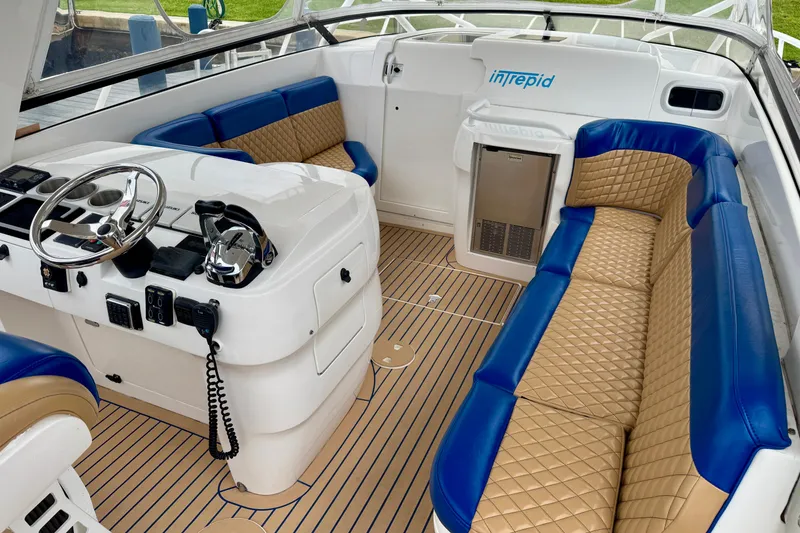 Slide: The Image of Luxurious interior of 2012 Intrepid 390 Sport Yacht with blue and tan seating. - 4