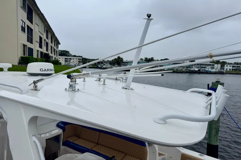 Slide: The Image of 2012 Intrepid 390 Sport Yacht with Garmin radar, docked near waterfront buildings. - 43