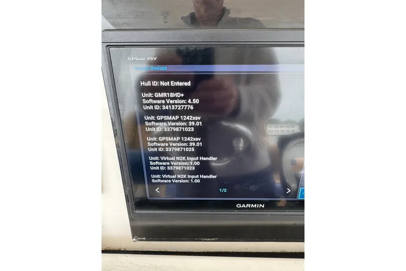 Slide: The Image of Garmin GPS device display on 2012 Intrepid 390 Sport Yacht showing software versions. - 53