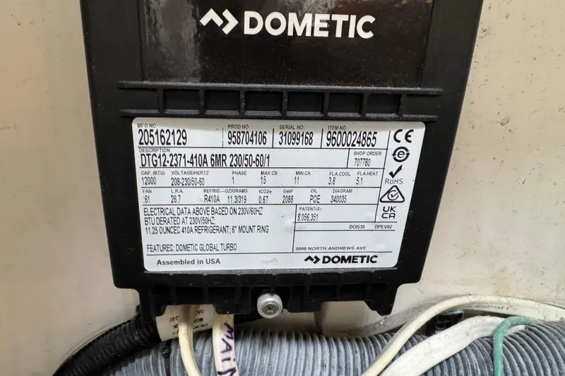 Slide: The Image of Dometic air conditioning unit label on a 2012 Intrepid 390 Sport Yacht. - 59