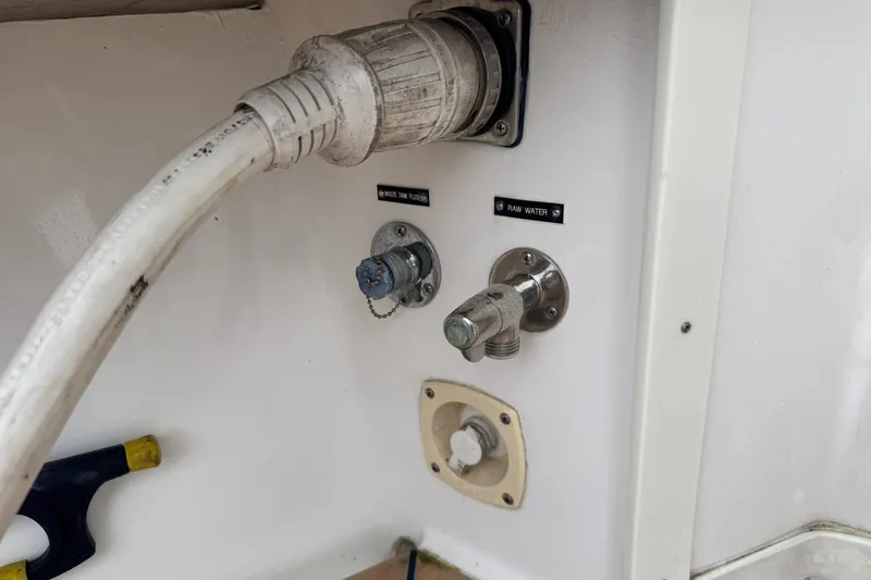 Slide: The Image of 2012 Intrepid 390 Sport Yacht water connections and waste tank flush system. - 60