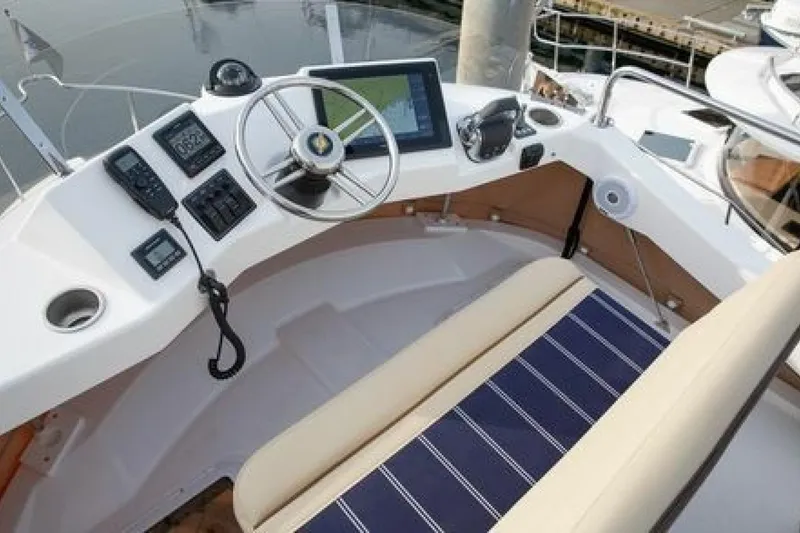 Slide: The Image of Helm of 2016 Ranger Tugs R-31 CB with navigation equipment and seating. - 10