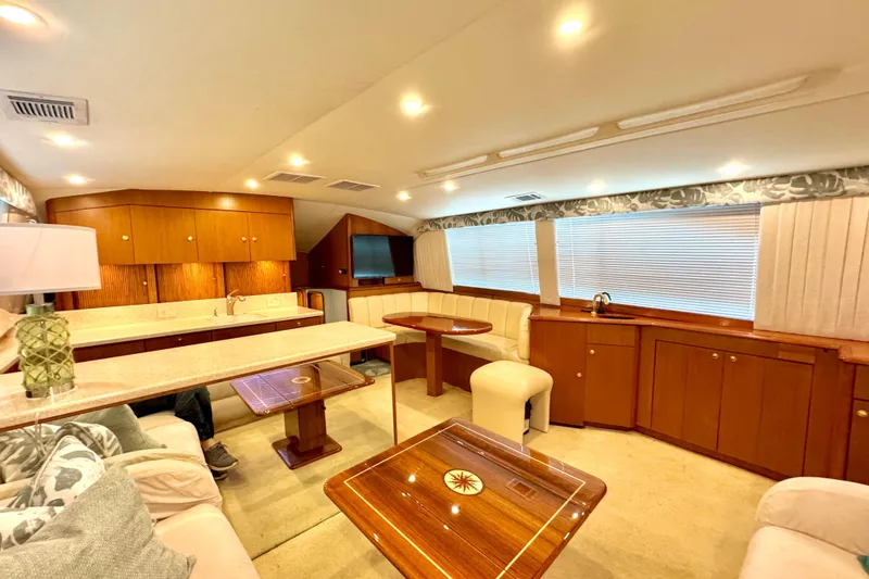 Slide: The Image of Luxurious interior of a 1998 Ocean Yachts 48 Super Sport with elegant wood finishes. - 15