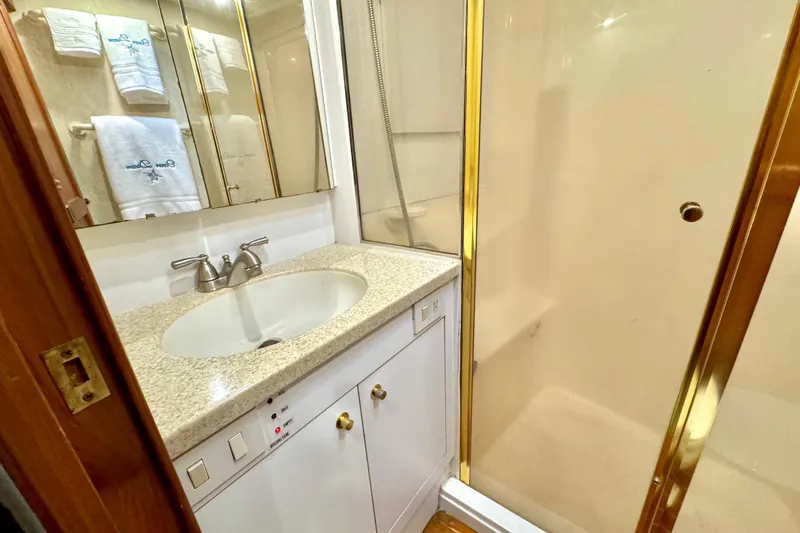 Slide: The Image of Bathroom interior of 1998 Ocean Yachts 48 Super Sport with sink and shower. - 18